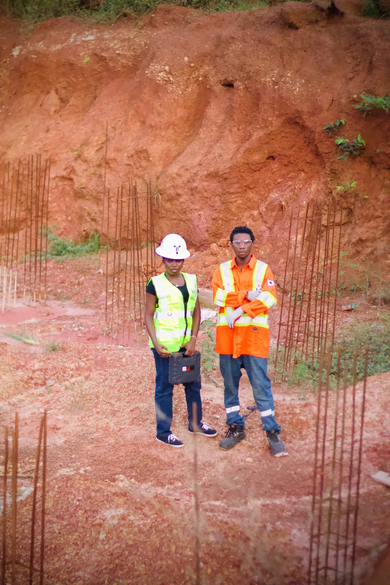Ghanaian civil engineers reviewing an industrial construction project