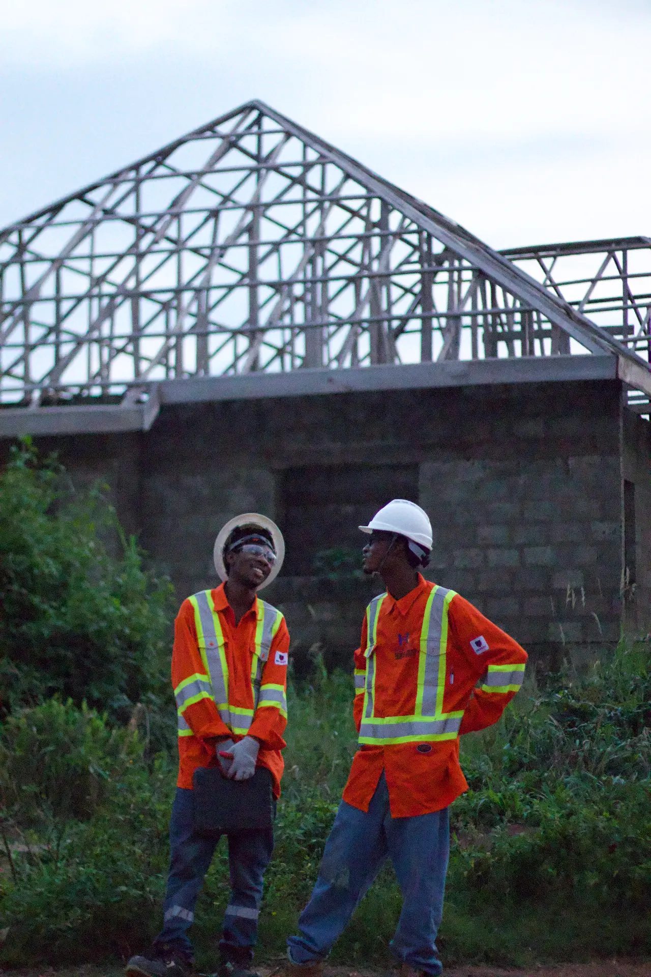 HEL engineers on a construction site with steel roof trusses